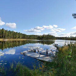Tranquil jetty in Northern Sweden, perfect for a serene lakeside retreat. Book now for an unforgettable Scandinavian getaway.