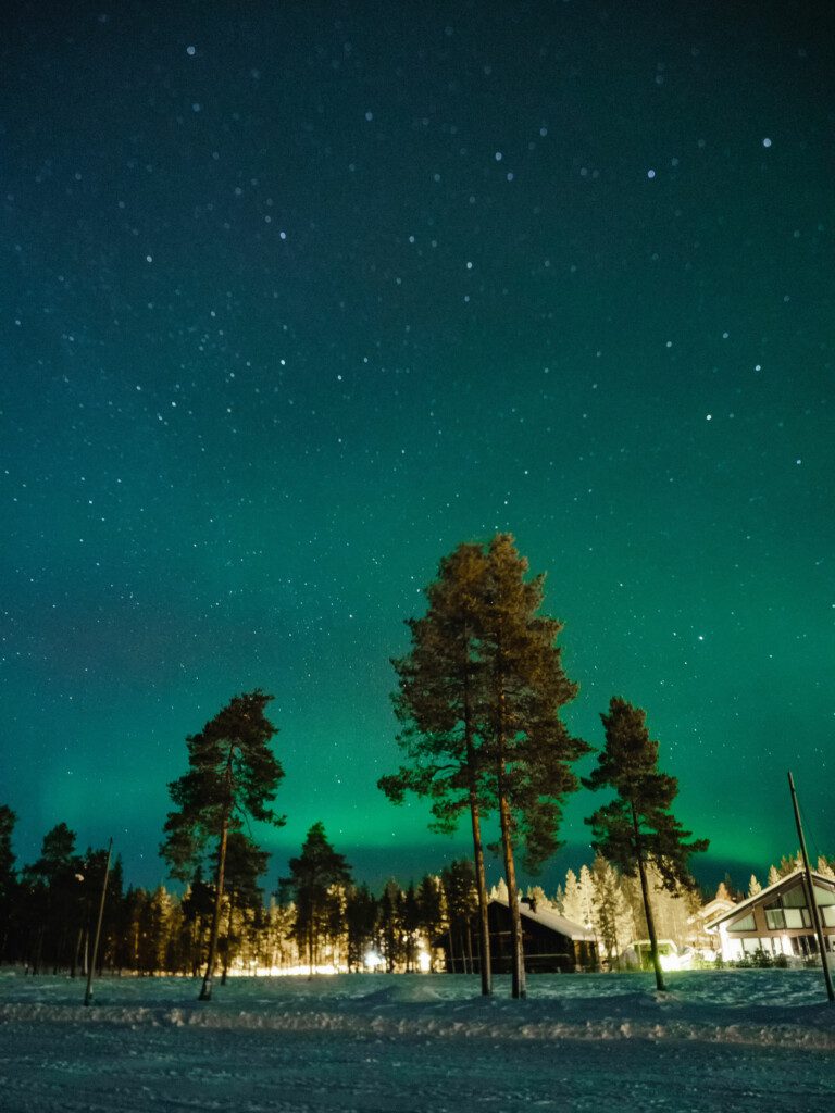 Northern Lights visible in the sky above Guestly Homes accommodation in Luleå.