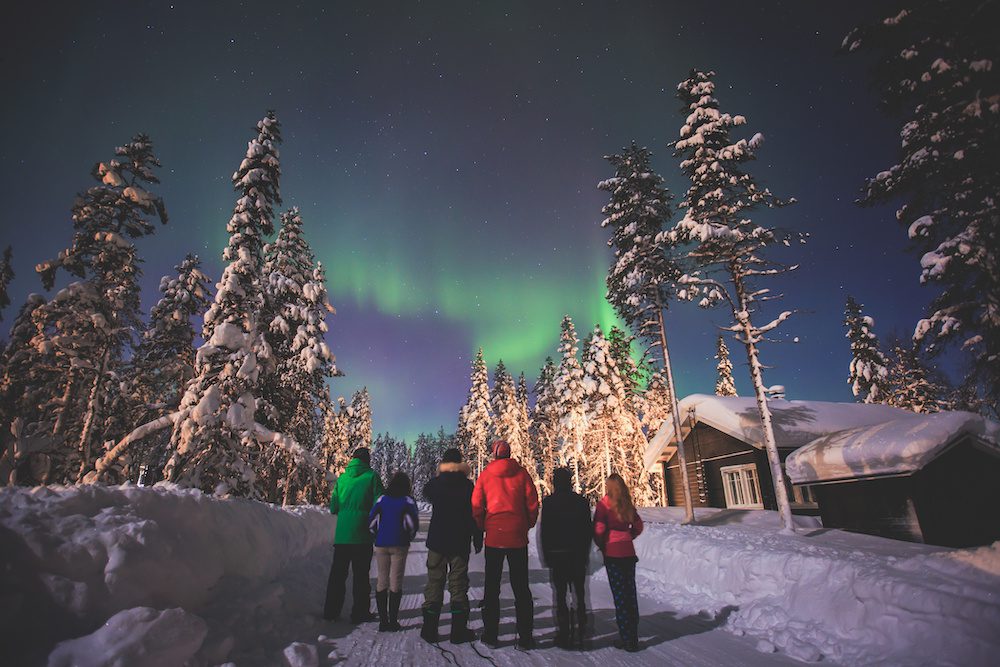 Friends viewing the northern lights together
