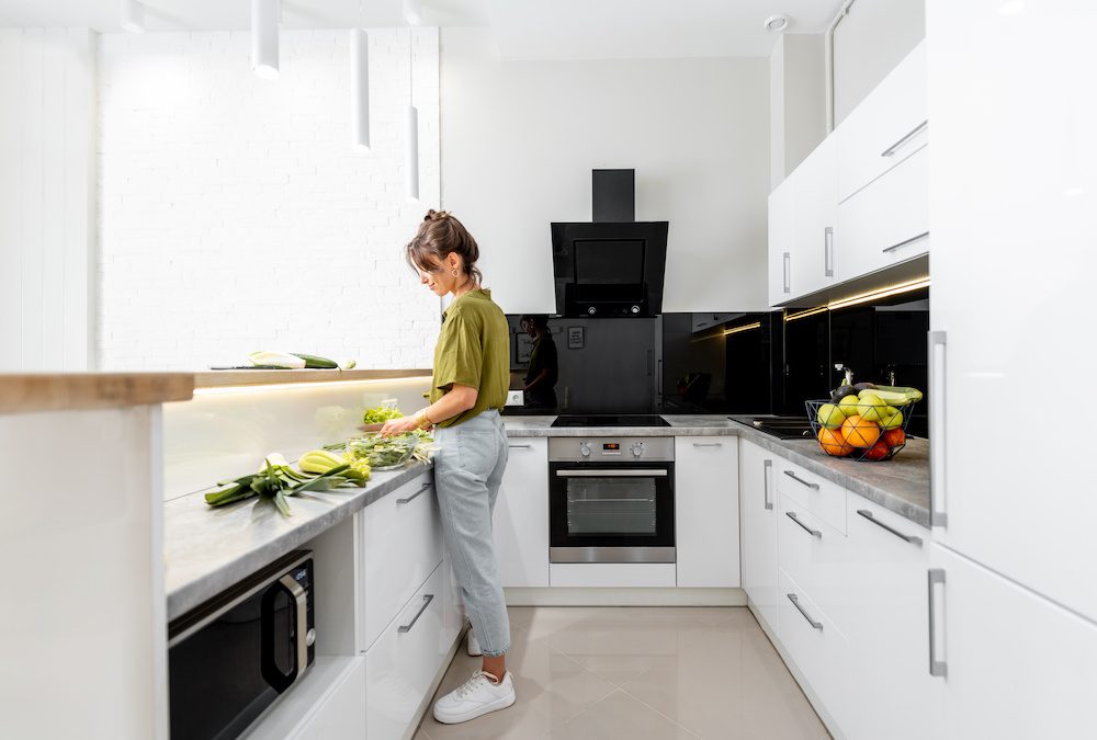 Woman cooking food in a modern Swedish home