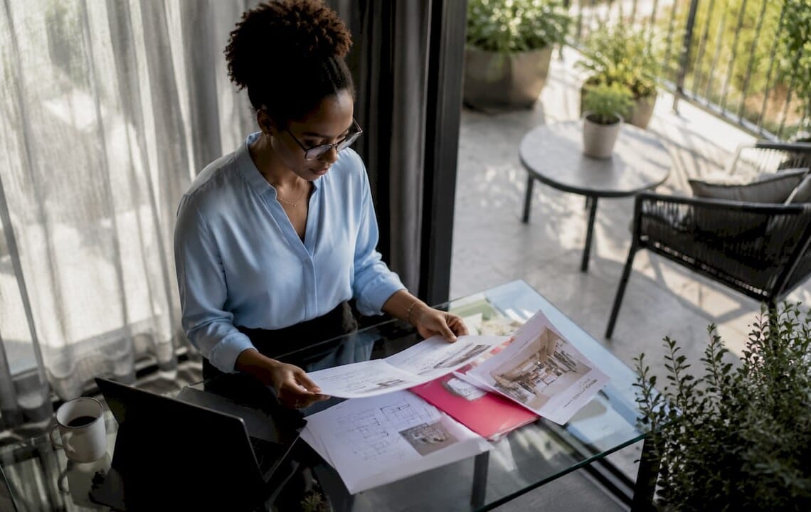 Professional woman reviewing corporate housing documents