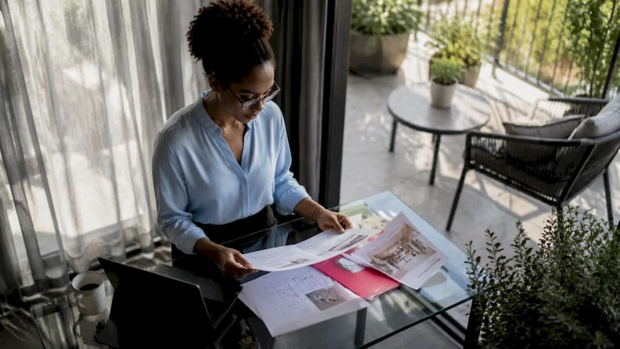 Professional woman reviewing corporate housing documents